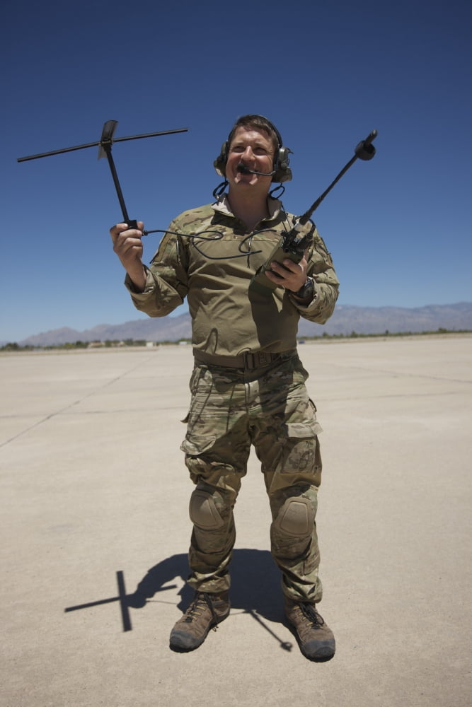 Pararescuemen conducts a communications check with his Sat radio Canvas Art - Terry MooreStocktrek Images (12 x 18)