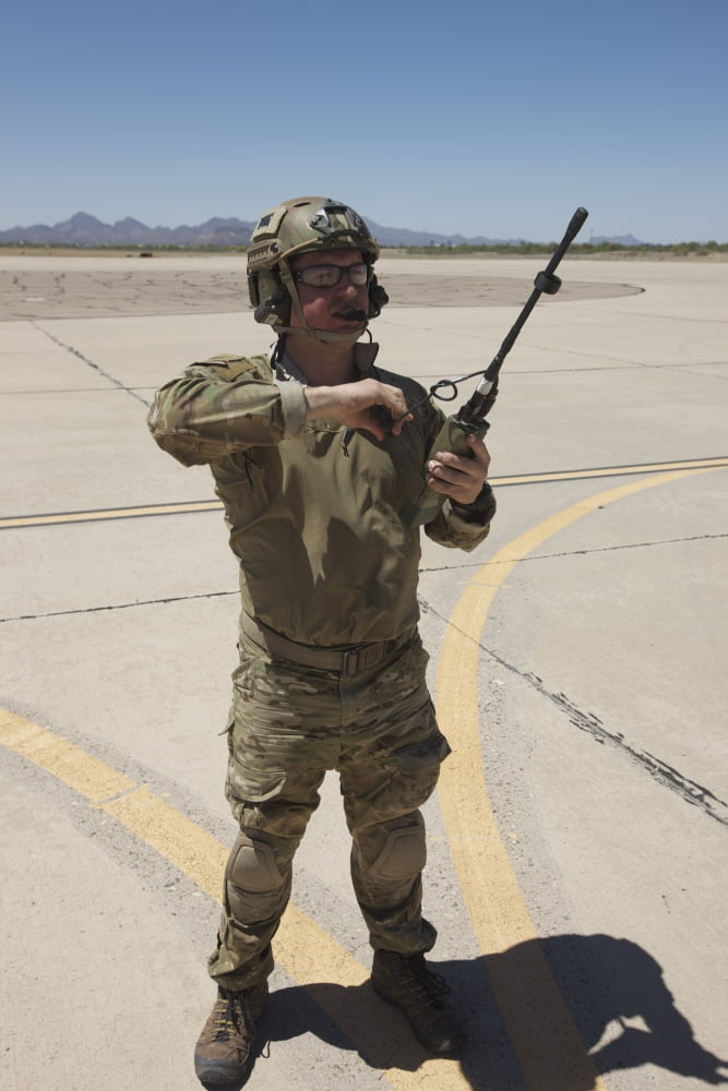 Pararescuemen conducts a communications check with his Sat radio Canvas Art - Terry MooreStocktrek Images (12 x 18)