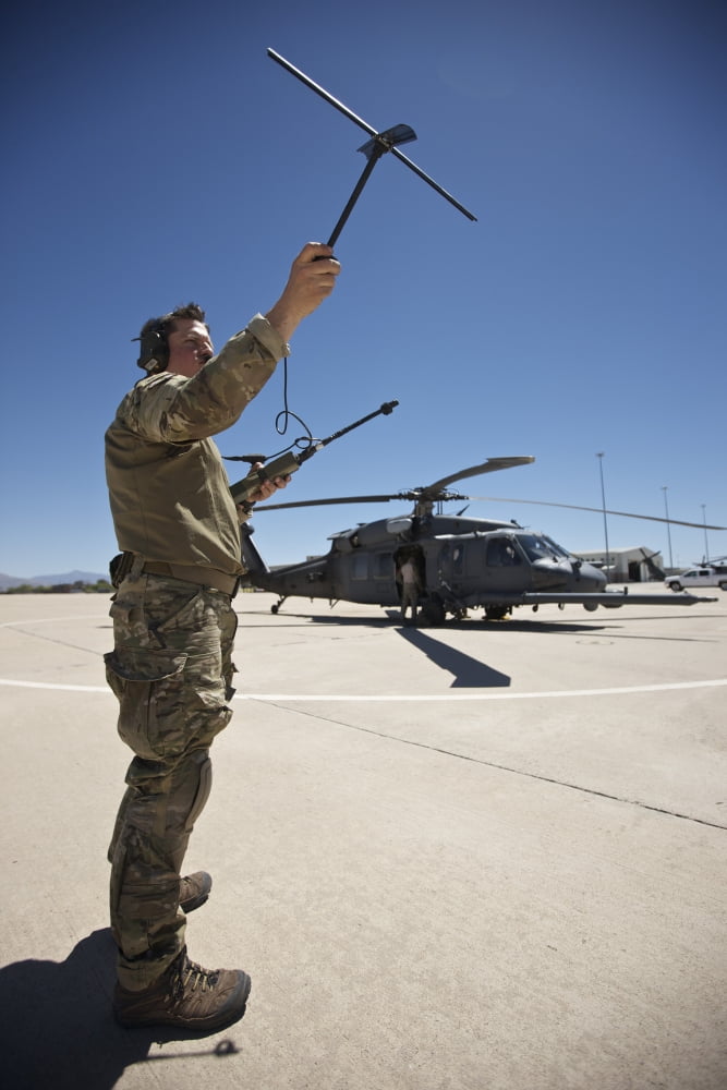 Pararescuemen conducts a communications check with his Sat radio Canvas Art - Terry MooreStocktrek Images (12 x 18)