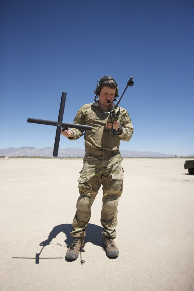 Pararescuemen conducts a communications check with his Sat radio Canvas Art - Terry MooreStocktrek Images (12 x 18)