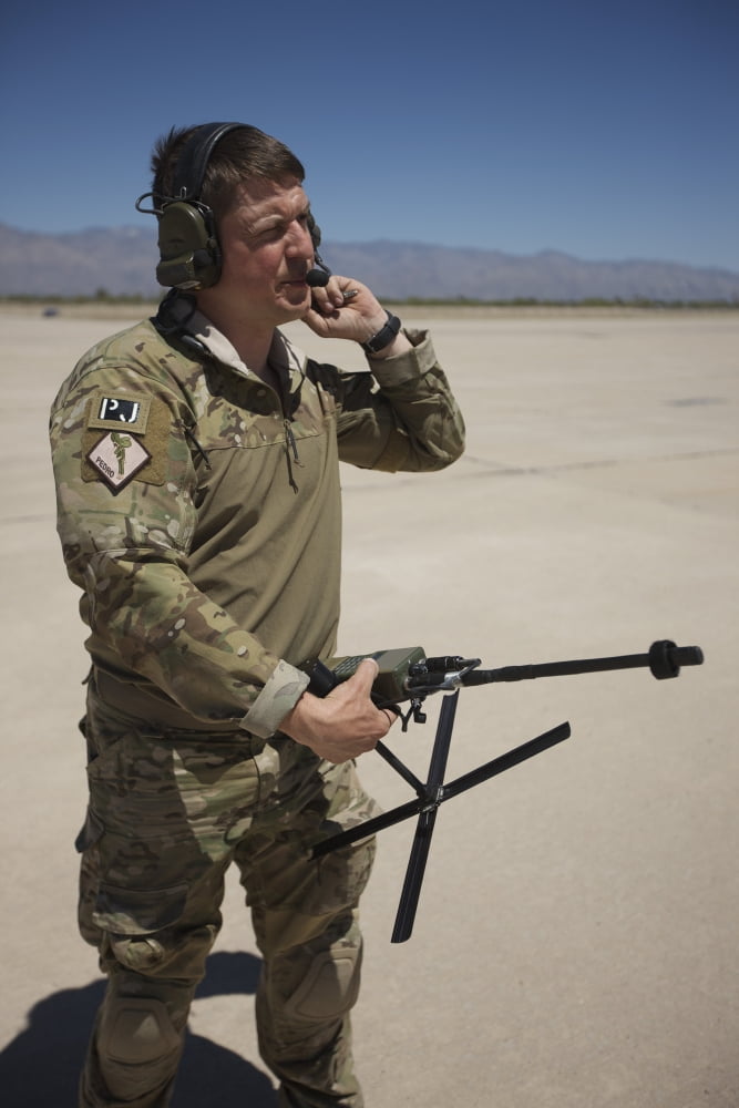 Pararescuemen conducts a communications check with his Sat radio Canvas Art - Terry MooreStocktrek Images (12 x 18)