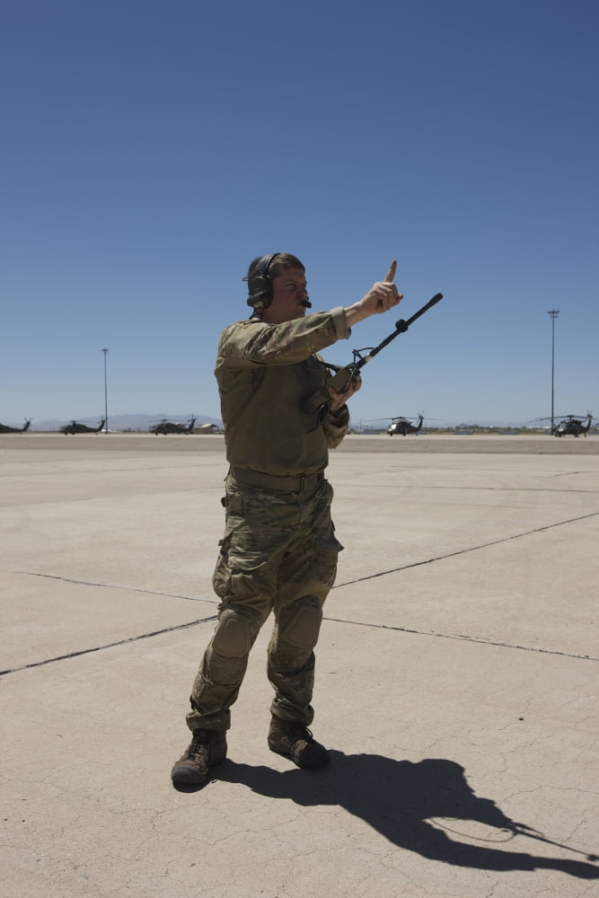 Pararescuemen conducts a communications check with his Sat radio Canvas Art - Terry MooreStocktrek Images (12 x 18)