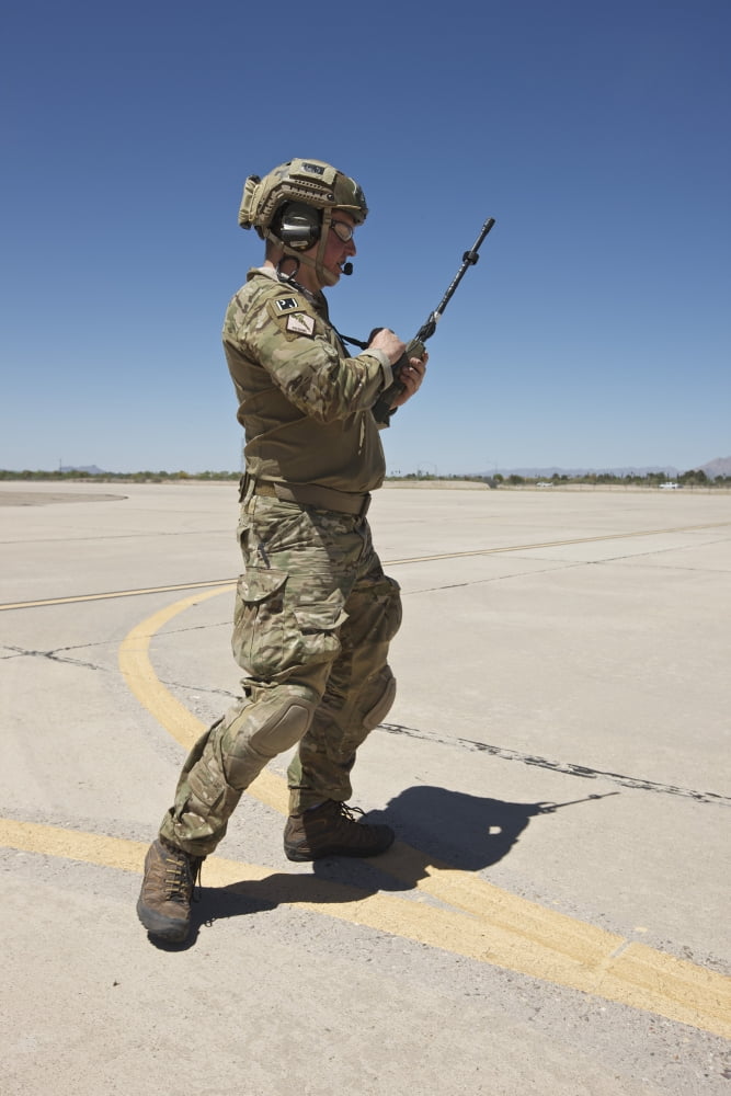 Pararescuemen conducts a communications check with his Sat radio Canvas Art - Terry MooreStocktrek Images (23 x 35)