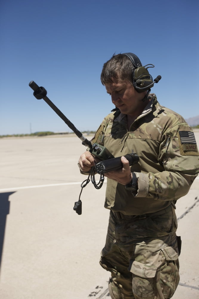Pararescuemen conducts a communications check with his Sat radio Canvas Art - Terry MooreStocktrek Images (23 x 35)