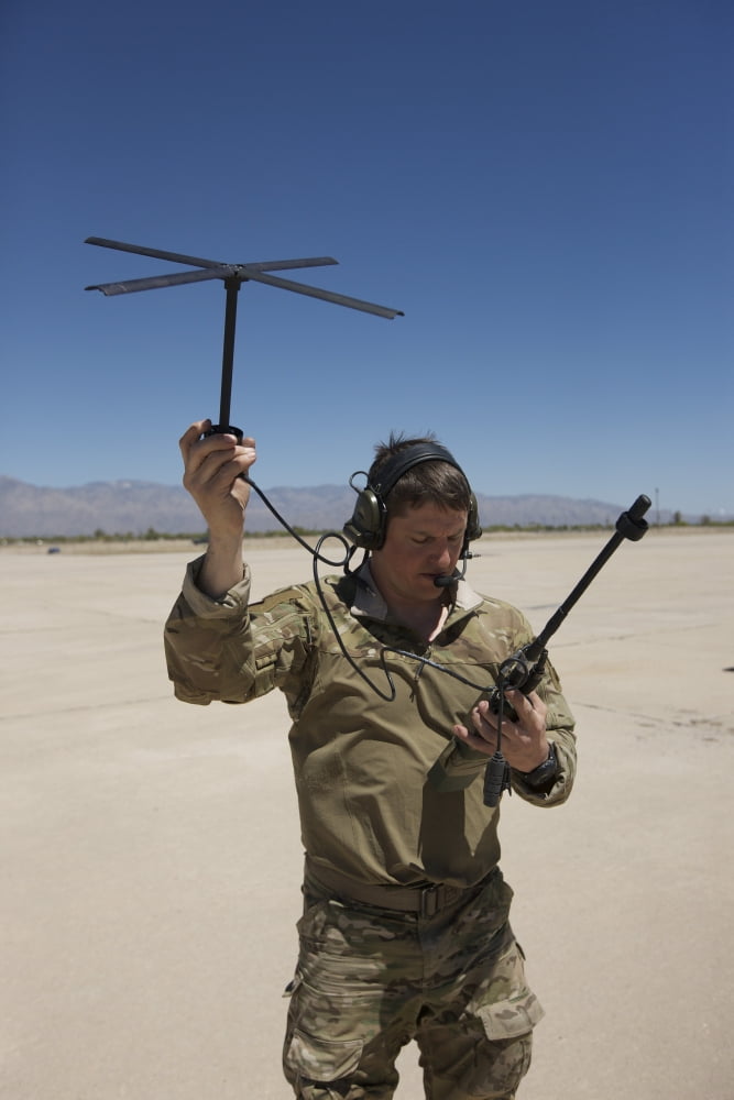 Pararescuemen conducts a communications check with his Sat radio Canvas Art - Terry MooreStocktrek Images (23 x 35)