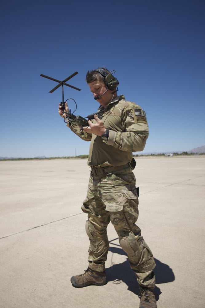 Pararescuemen conducts a communications check with his Sat radio Canvas Art - Terry MooreStocktrek Images (23 x 35)