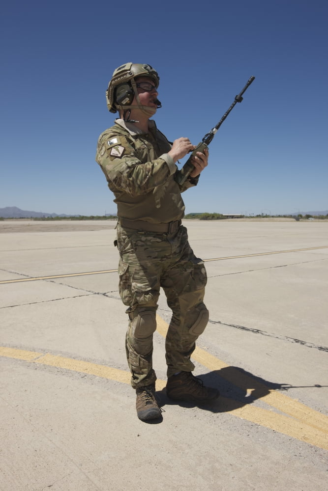 Pararescuemen conducts a communications check with his Sat radio Canvas Art - Terry MooreStocktrek Images (23 x 35)