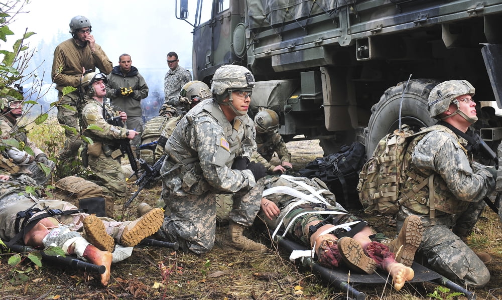 Pararescuemen prepare to transport wounded soldiers Canvas Art - Stocktrek Images (37 x 22)