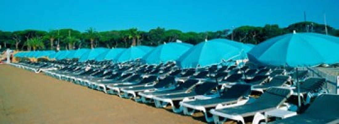 Parasols with lounge chairs on a private beach in summer morning light French Riviera Provence-Alpes-Cote dAzur France Canvas Art - Panoramic Images (18 x 7)