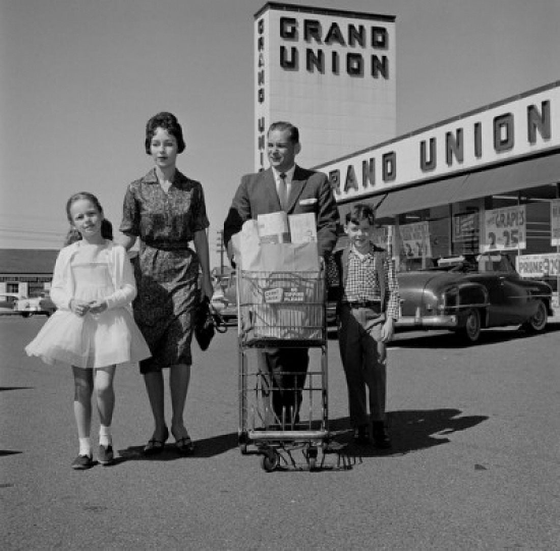 Parents and kids walking across supermarket parking lot with shopping Canvas Art - (18 x 24)