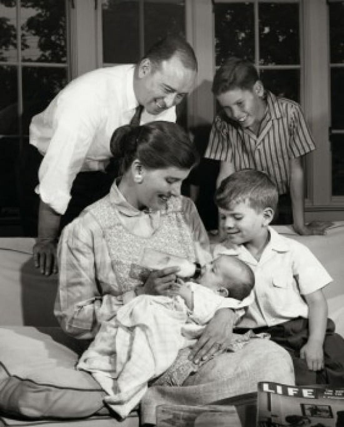Parents and their children in living room Canvas Art - (18 x 24)
