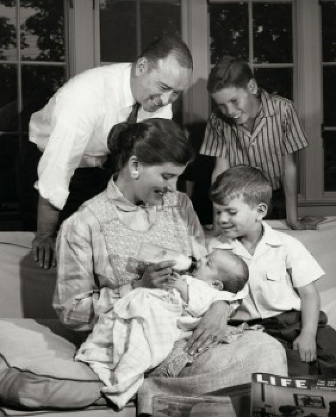 Parents and their children in living room Canvas Art - (24 x 36)