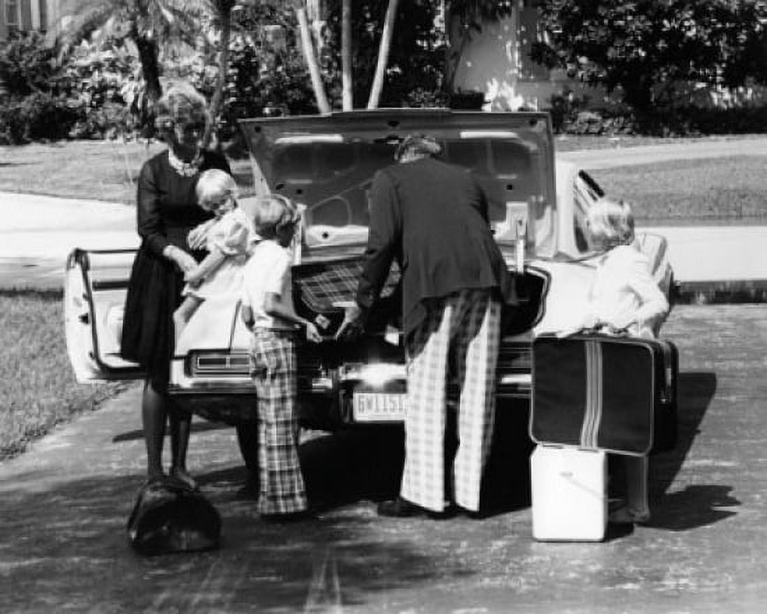 Parents and their children loading luggage into a car Canvas Art - (24 x 36)