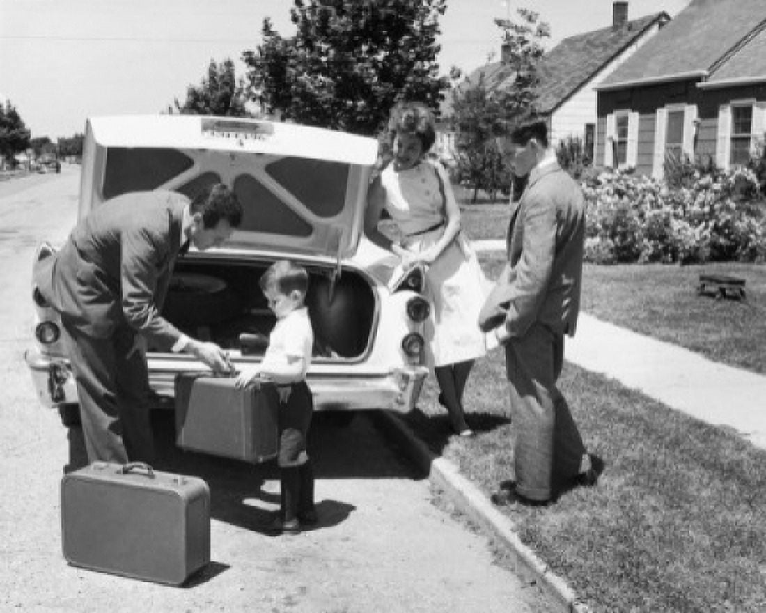 Parents and their children loading luggage into a car Canvas Art - (24 x 36)
