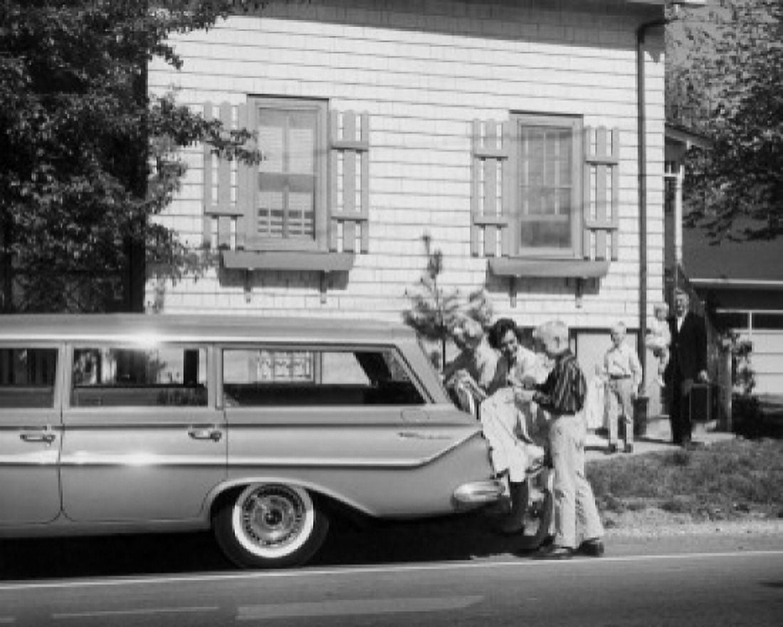Parents and their children loading luggage into a car Canvas Art - (24 x 36)