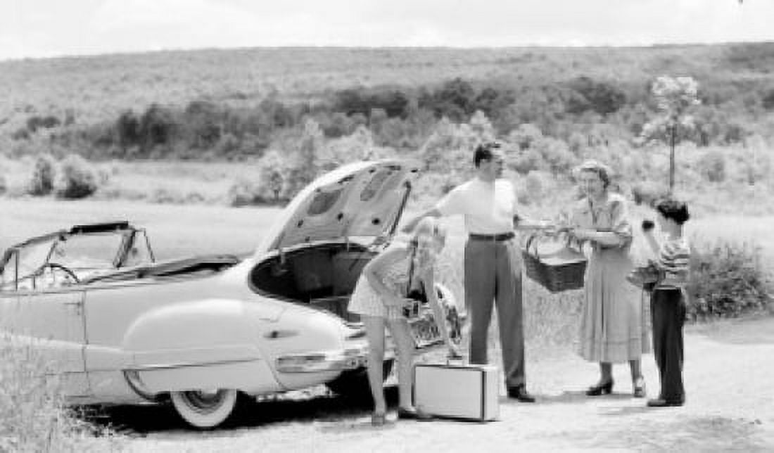 Parents and their children loading luggage into a car Canvas Art - (24 x 36)