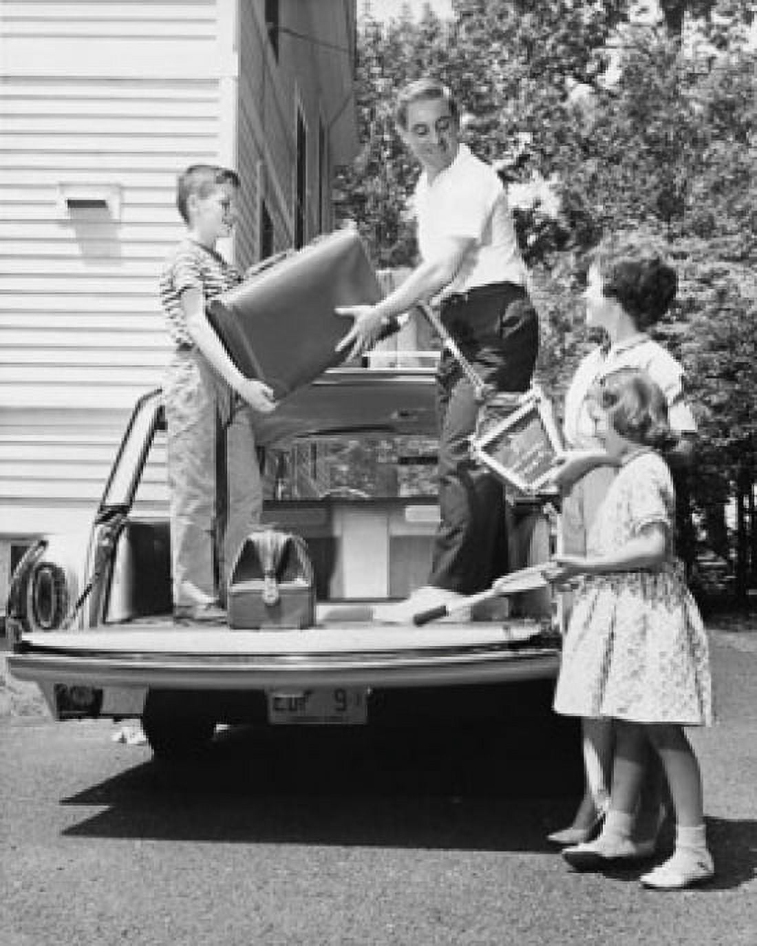 Parents and their children loading luggage onto a car Canvas Art - (18 x 24)