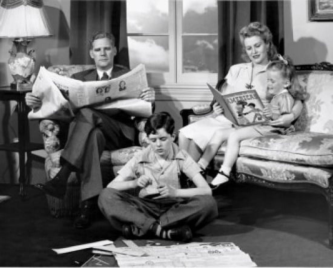Parents and their children reading in the living room Canvas Art - (18 x 24)