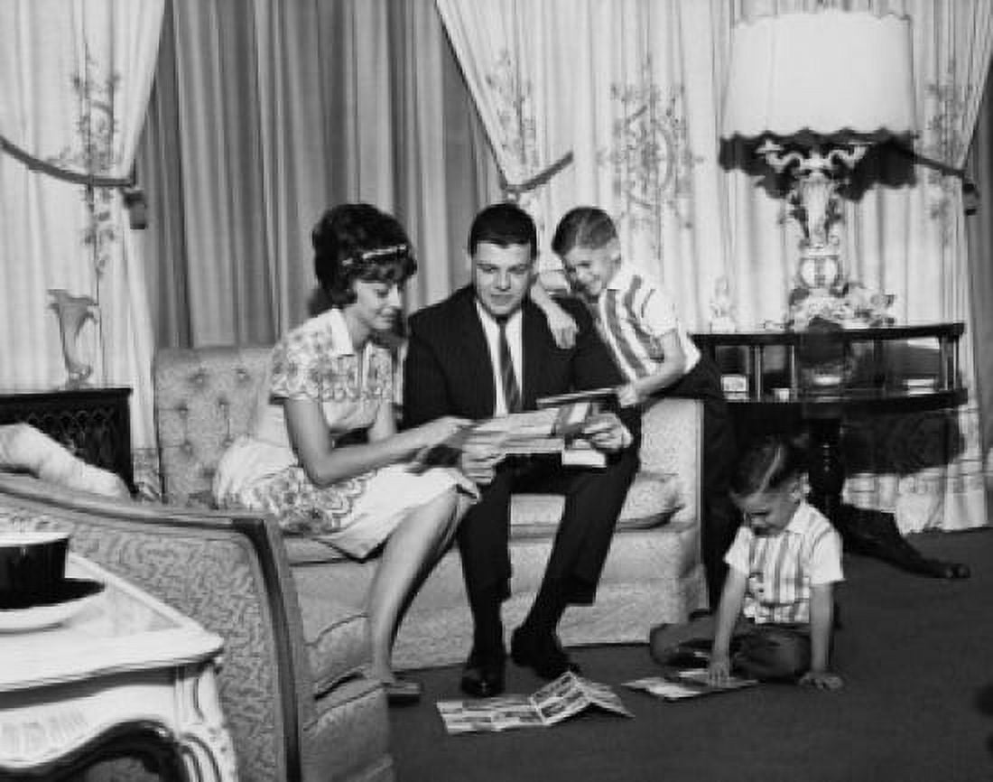 Parents and their children sitting in a living room Canvas Art -  (18 x 24)