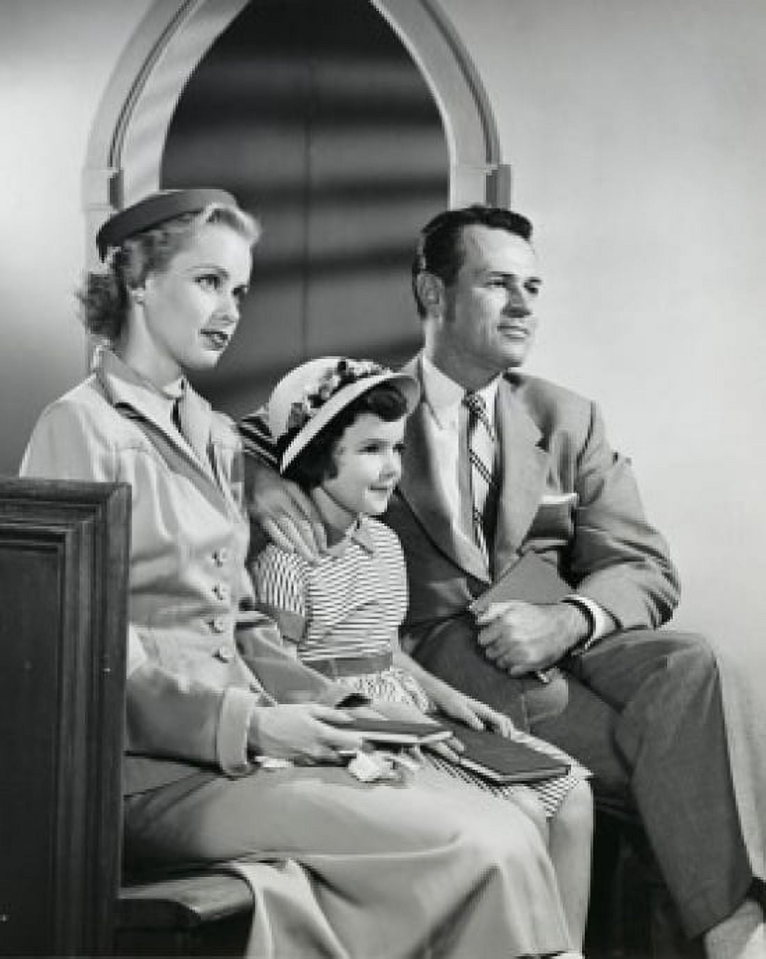 Parents and their daughter sitting in a church Canvas Art - (18 x 24)