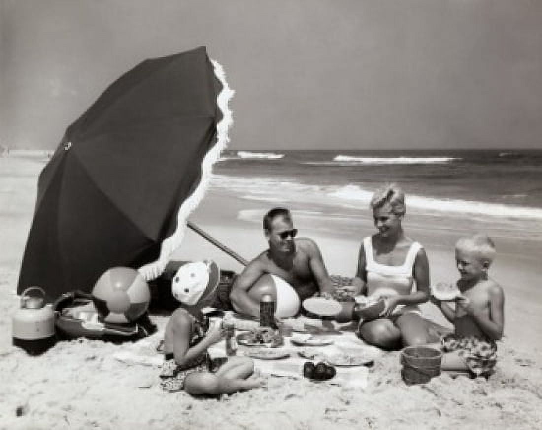 Parents and their two children having a picnic on the beach Canvas Art - (18 x 24)