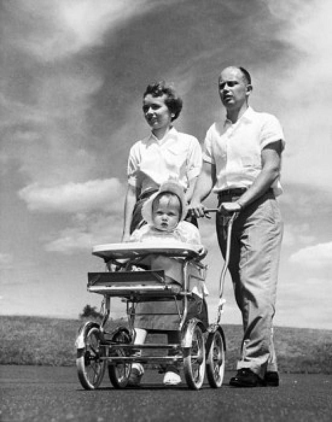 Parents pushing their daughter in a baby stroller Canvas Art - (18 x 24)