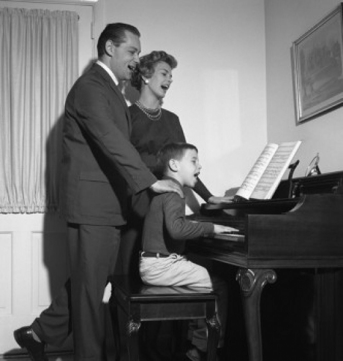 Parents singing with son playing piano Canvas Art - (24 x 36)