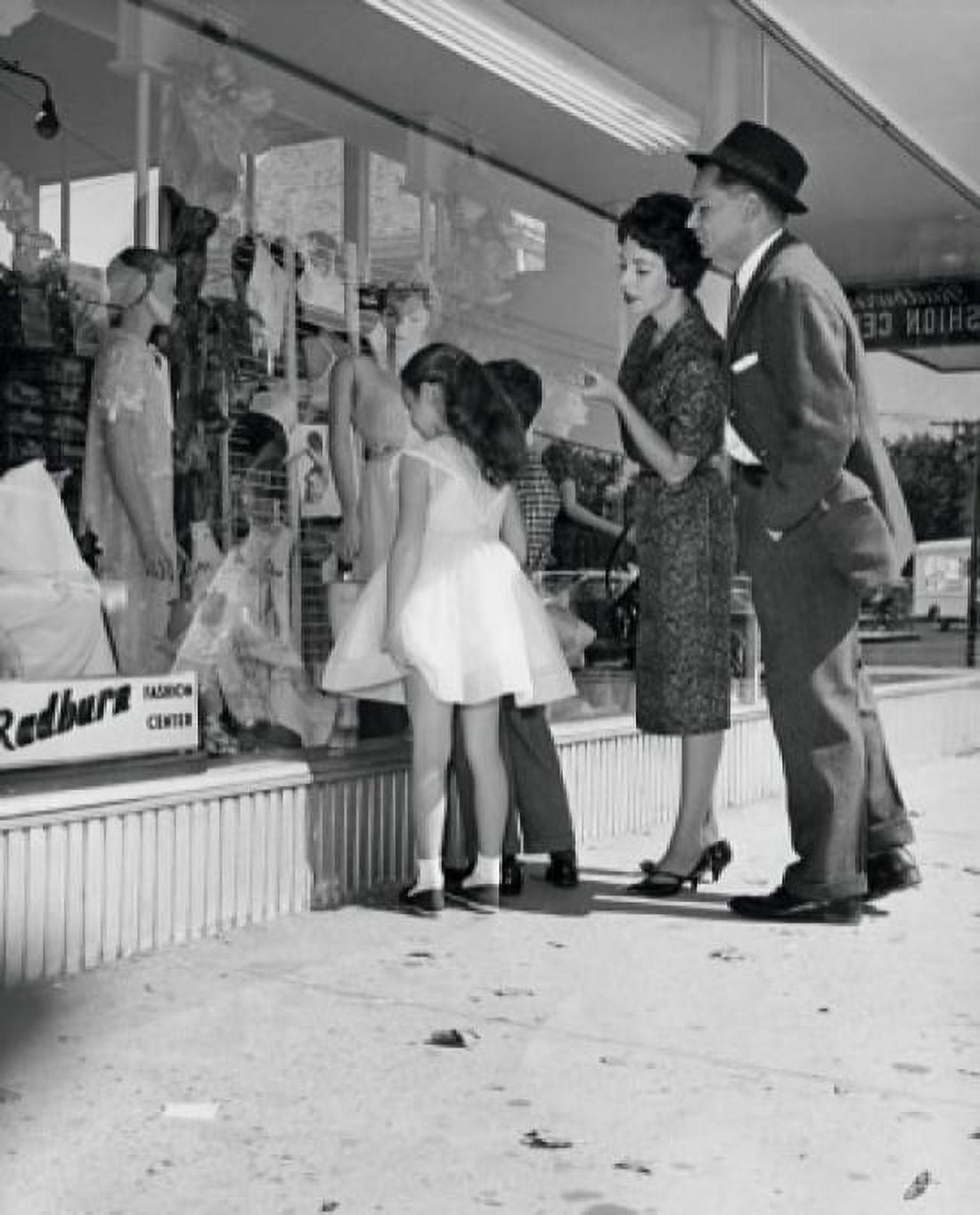 Parents standing in front of a shop with their two children Canvas Art - (24 x 36)