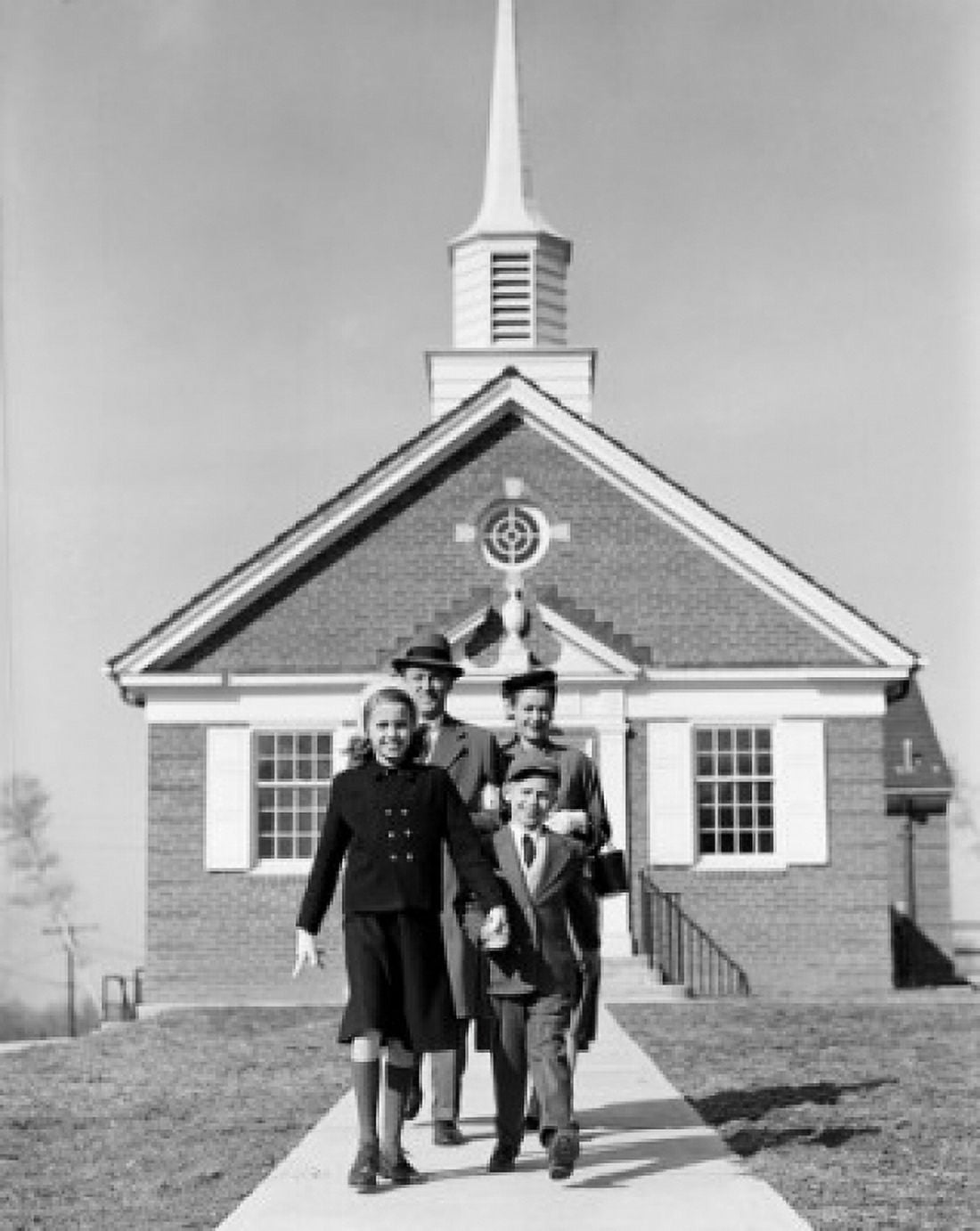 Parents with children in front of church Canvas Art - (18 x 24)