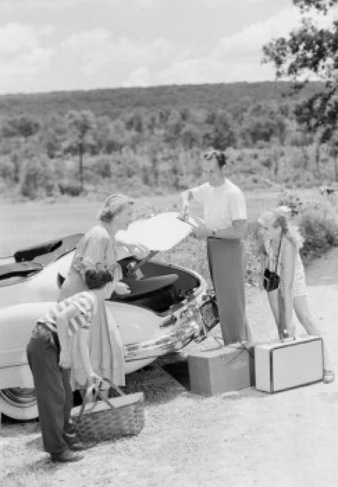 Parents with children loading suitcases into car Canvas Art - (18 x 24)
