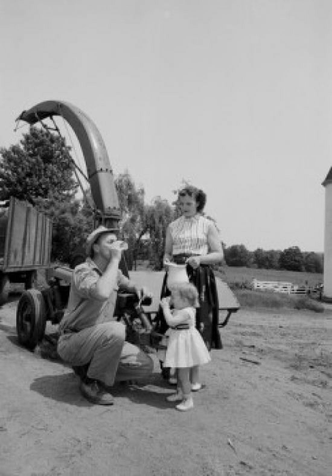 Parents with daughter drinking milk on farm Canvas Art - (18 x 24)