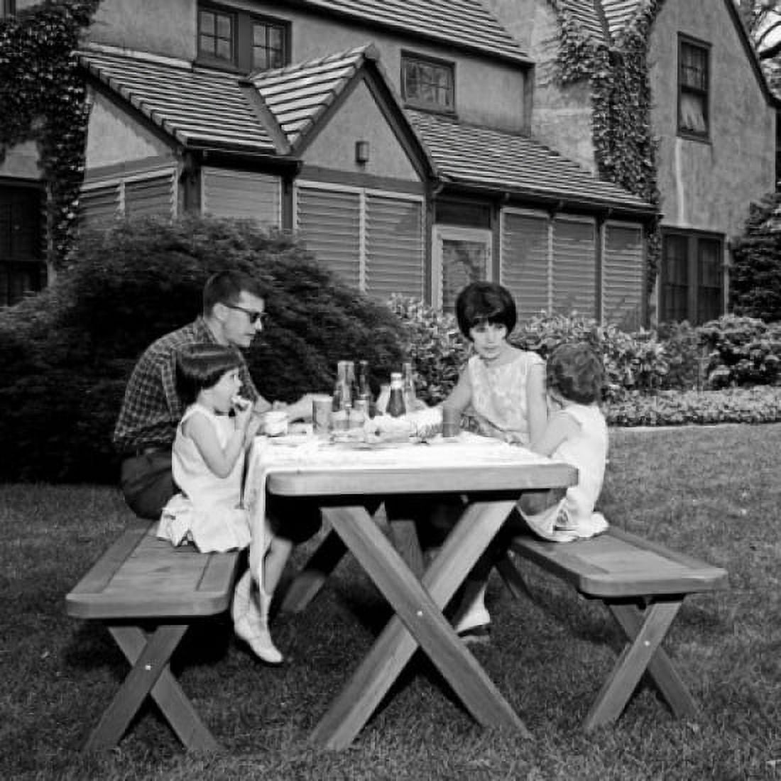 Parents with daughters at picnic table in garden Canvas Art - (24 x 36)
