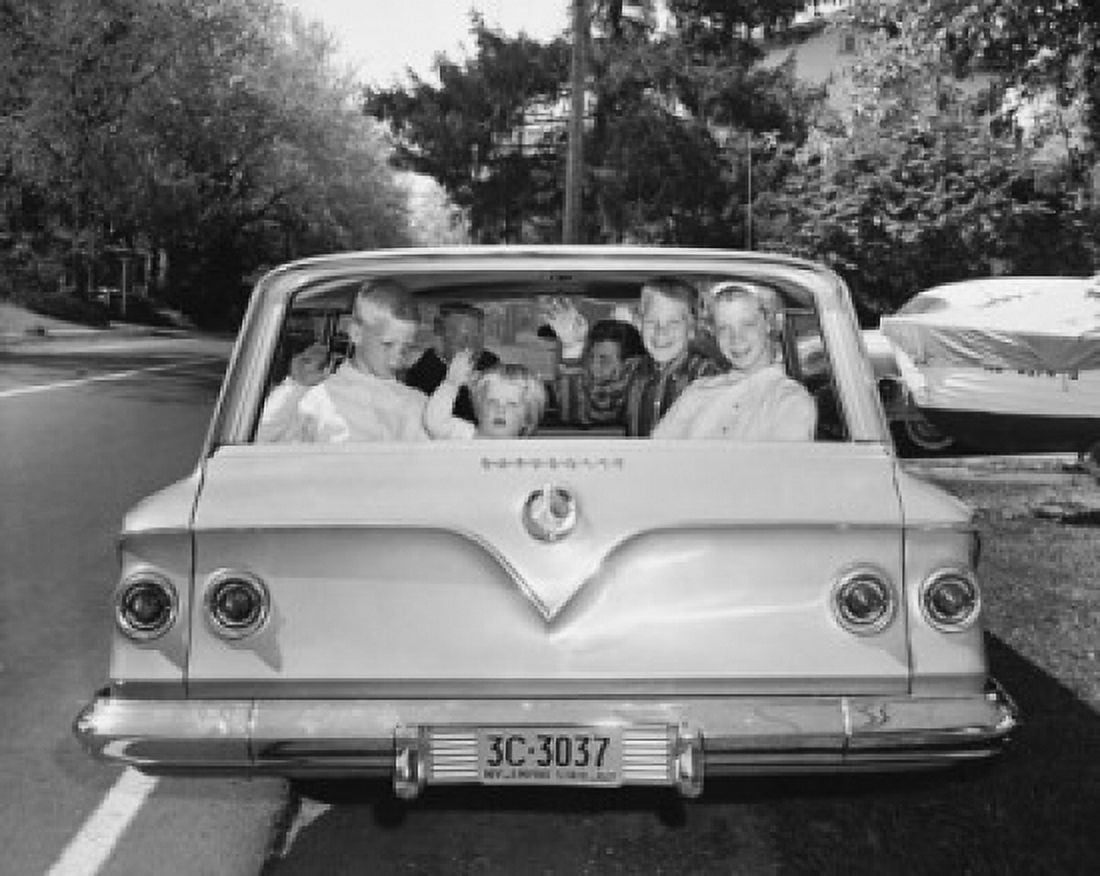 Parents with four children traveling in car Canvas Art - (18 x 24)