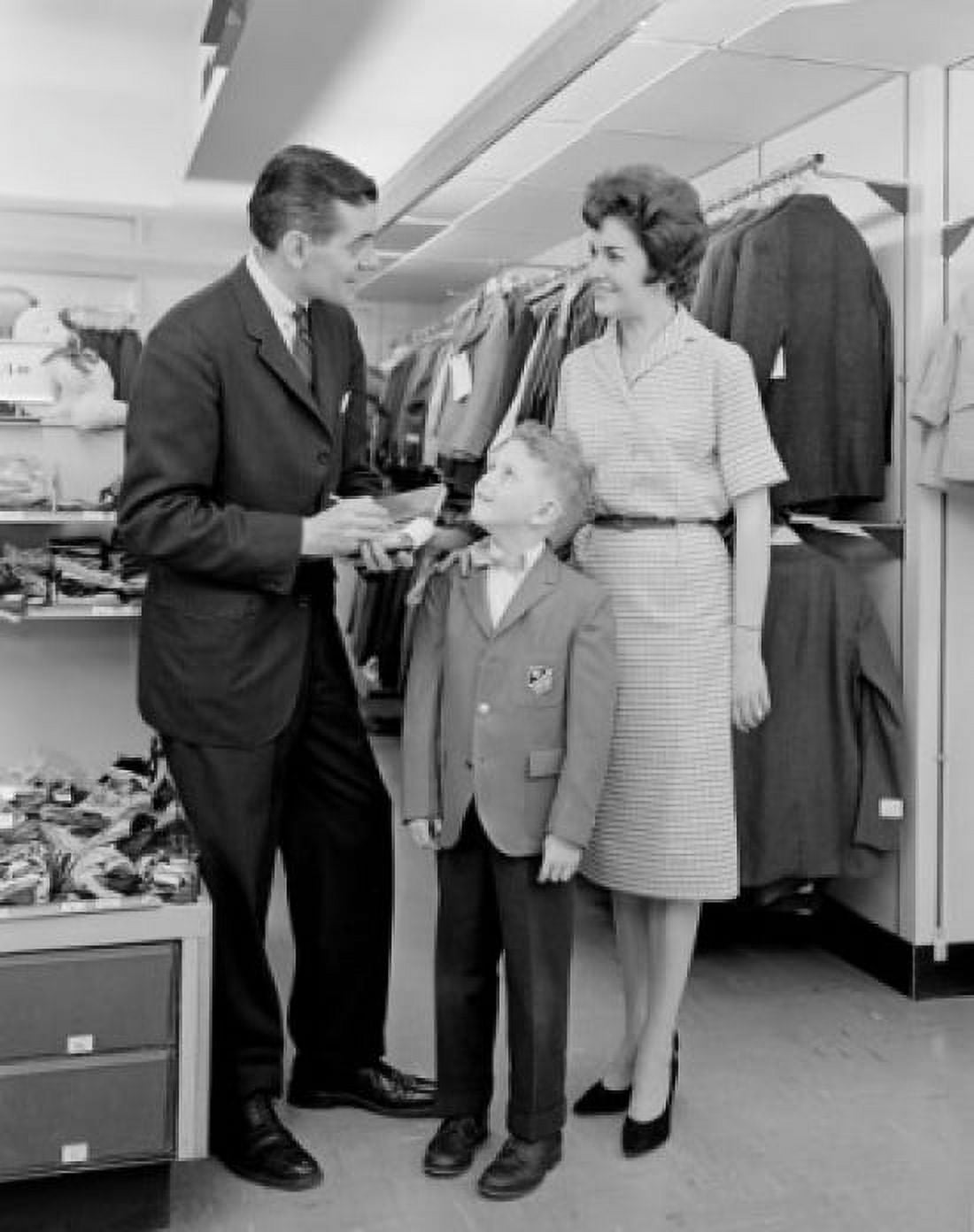 Parents with son in clothes shop Canvas Art - (18 x 24)