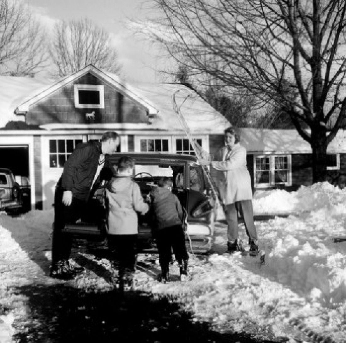 Parents with sons packing for winter holidays Canvas Art - (18 x 24)