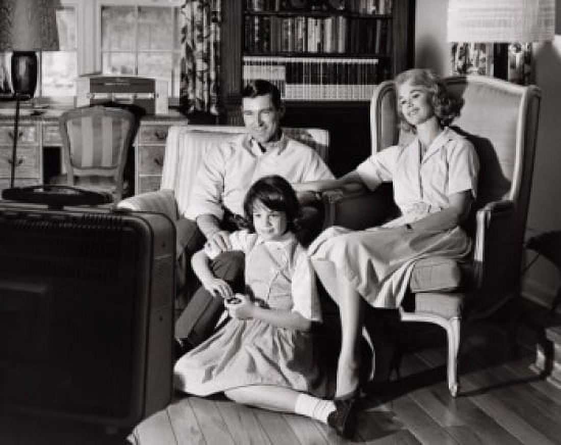 Parents with their daughter watching television Canvas Art - (18 x 24)