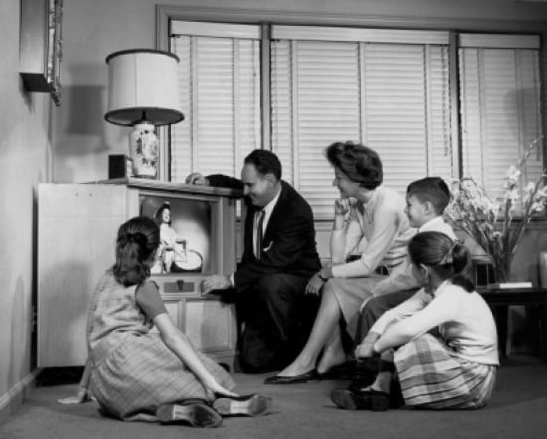 Parents with their three children watching television Canvas Art - (24 x 36)