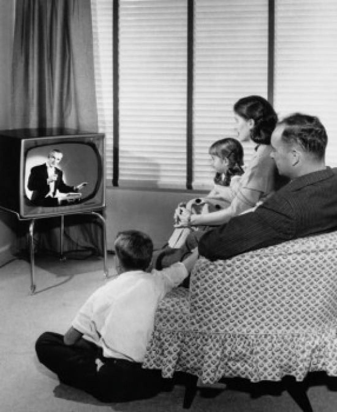 Parents with their two children watching television Canvas Art - (18 x 24)