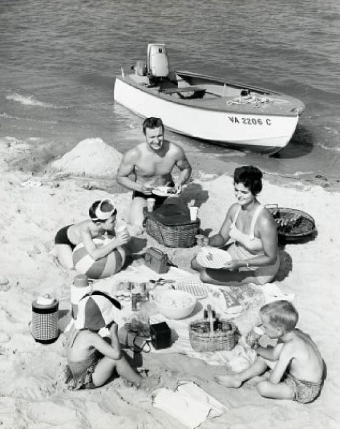 Parents with three children having picnic on beach Canvas Art - (18 x 24)