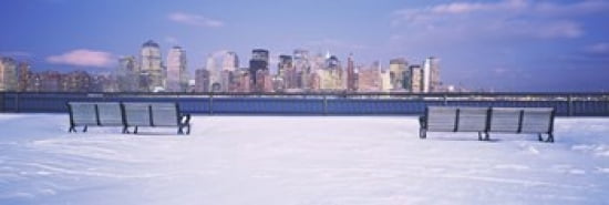 Park benches in snow with a city in the background Lower Manhattan Manhattan New York City New York State USA Canvas Art - Panoramic Images (36 x 12)