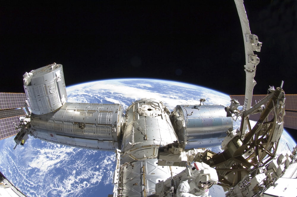 Part of the International Space Station in orbit above Earth Canvas Art - Stocktrek Images (34 x 23)