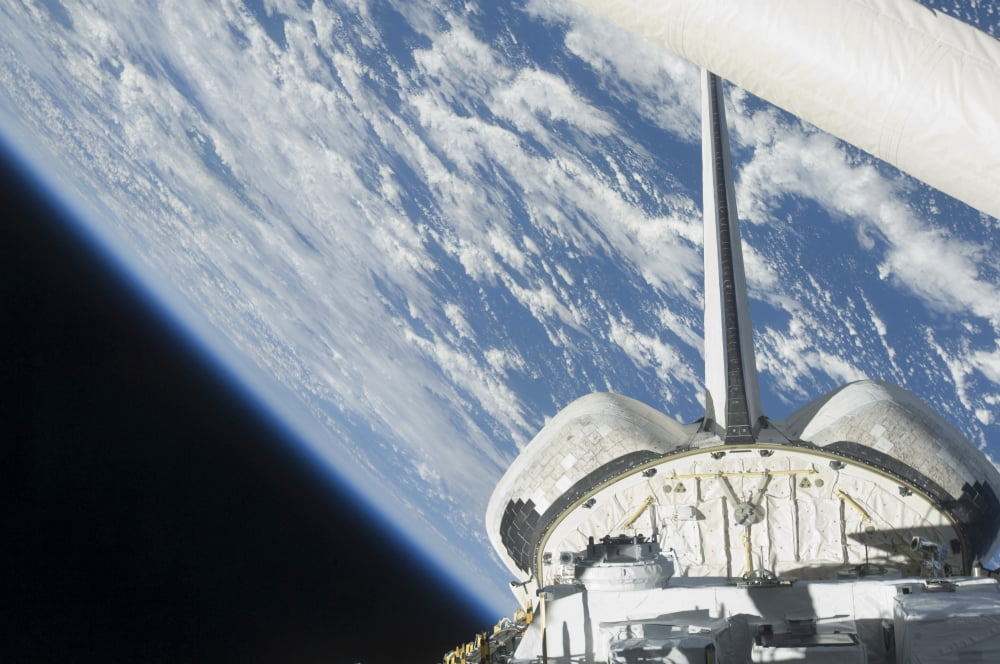 Partial view of Space Shuttle Endeavour backdropped against Earth Canvas Art - Stocktrek Images (34 x 23)