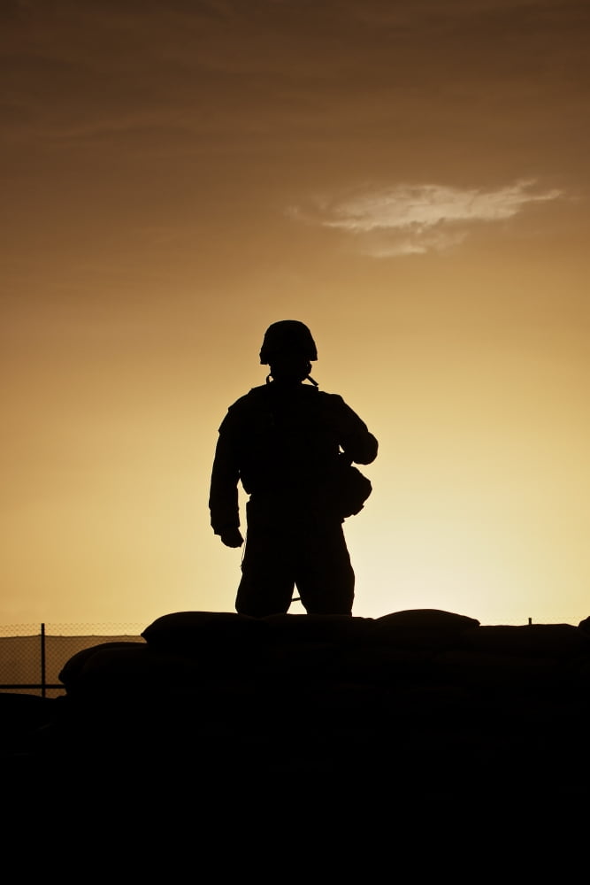 Partially silhouetted US Marine on a bunker in Afghanistan Canvas Art - Terry MooreStocktrek Images (24 x 35)