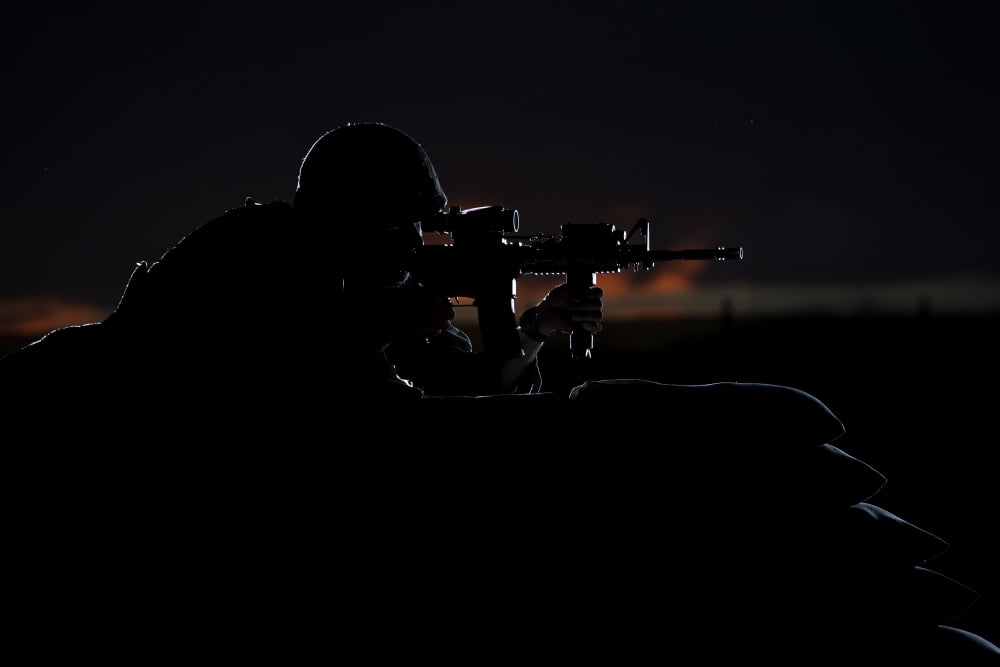 Partially silhouetted US Marine on a bunker in Afghanistan Canvas Art - Terry MooreStocktrek Images (35 x 24)