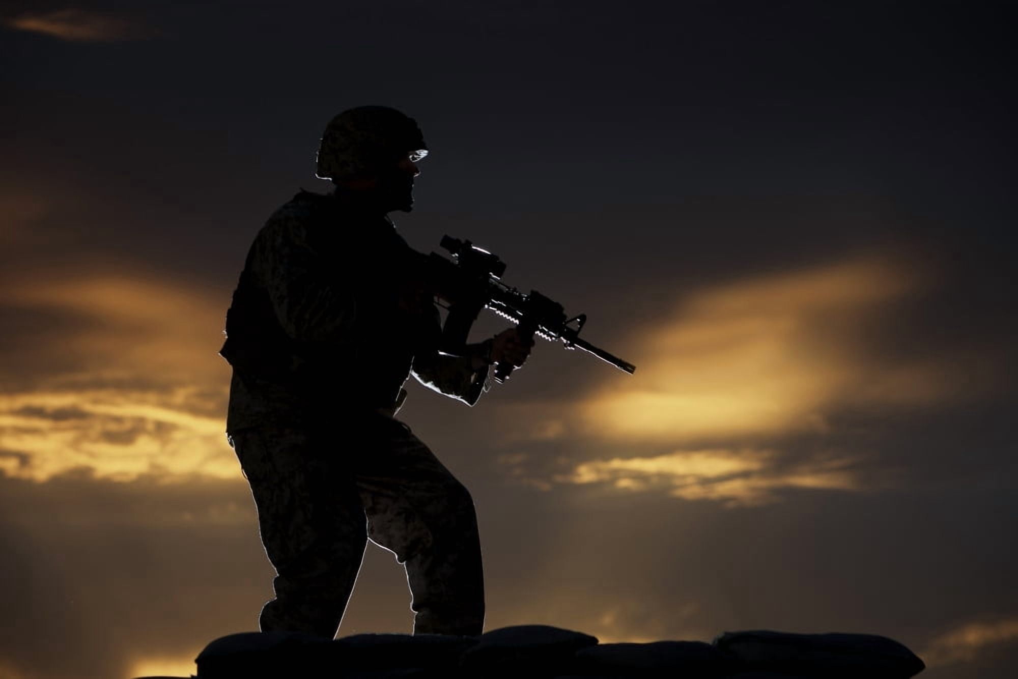 Partially silhouetted US Marine on a bunker in Northern Afghanistan Canvas Art - Terry MooreStocktrek Images (18 x 12)
