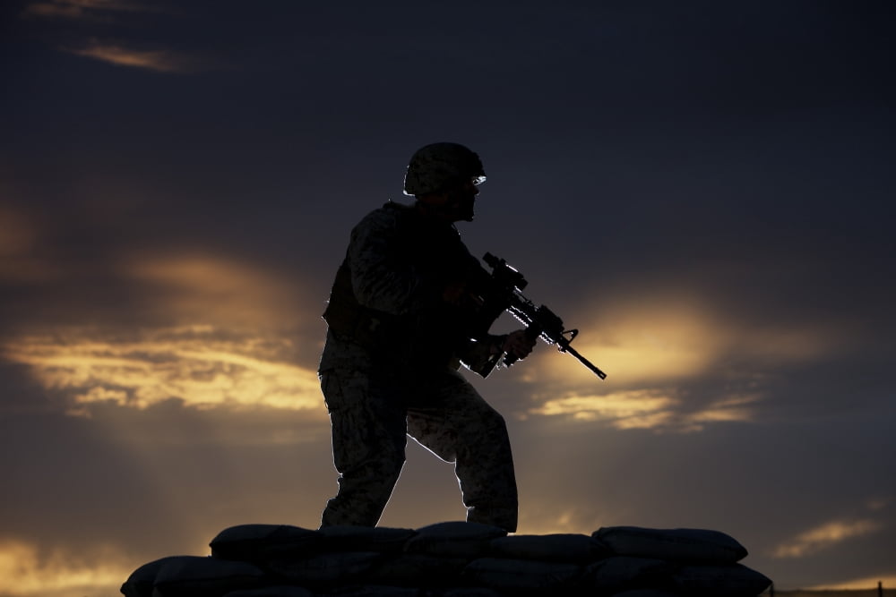 Partially silhouetted US Marine on a bunker in Northern Afghanistan Canvas Art - Terry MooreStocktrek Images (18 x 12)