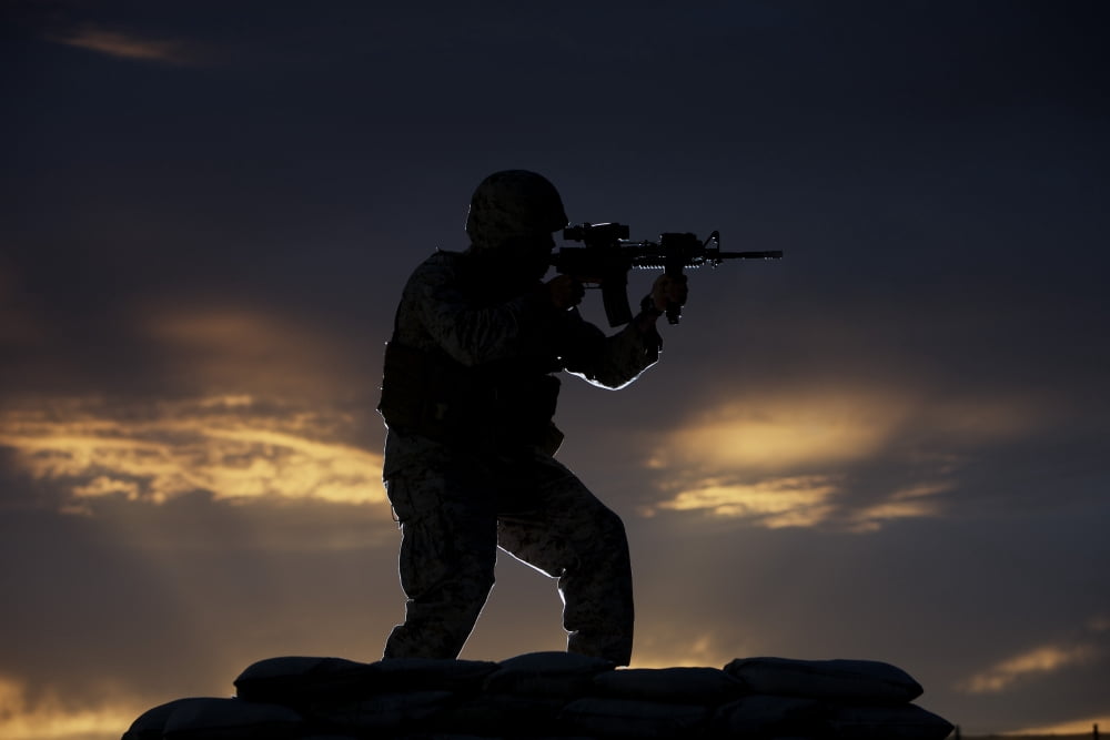 Partially silhouetted US Marine on a bunker in Northern Afghanistan Canvas Art - Terry MooreStocktrek Images (35 x 24)