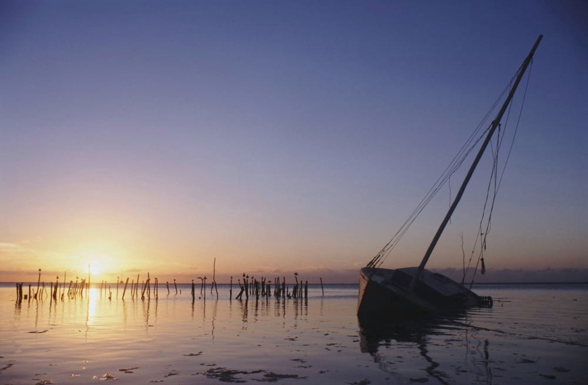 Partly Submerged And Keeling Sail Boat In Silhouette At Sunset Canvas Art - James Sparshatt Design Pics (17 x 11)