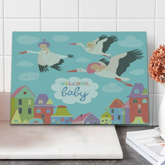 Party Cutting Board, Storks Flying over Town Delivering Cartoon City Announcement, Decorative Tempered Glass Cutting and Serving Board, Large Size, Multicolor, by Ambesonne