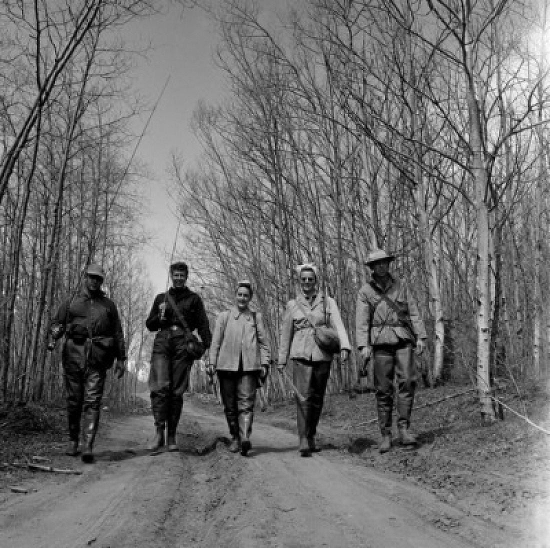 Party of friends with fishing rods on dirt road Canvas Art - (24 x 36)